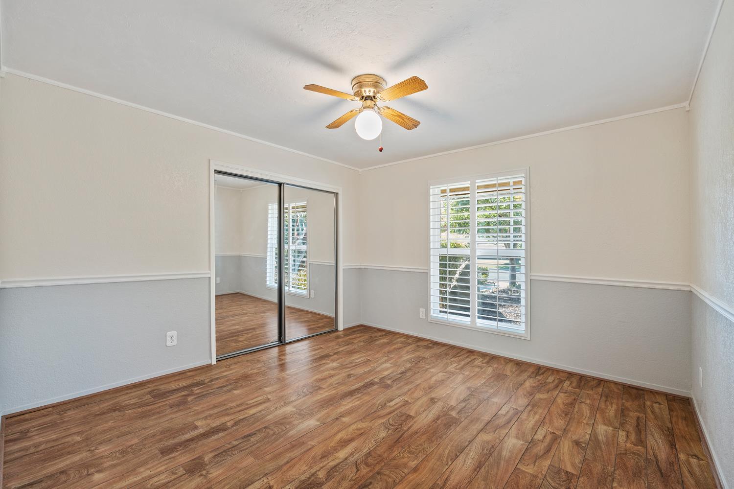 2179 Rall Avenue Clovis, CA 93611 - Photo 27 of 54 wooden floor in an empty room with a window