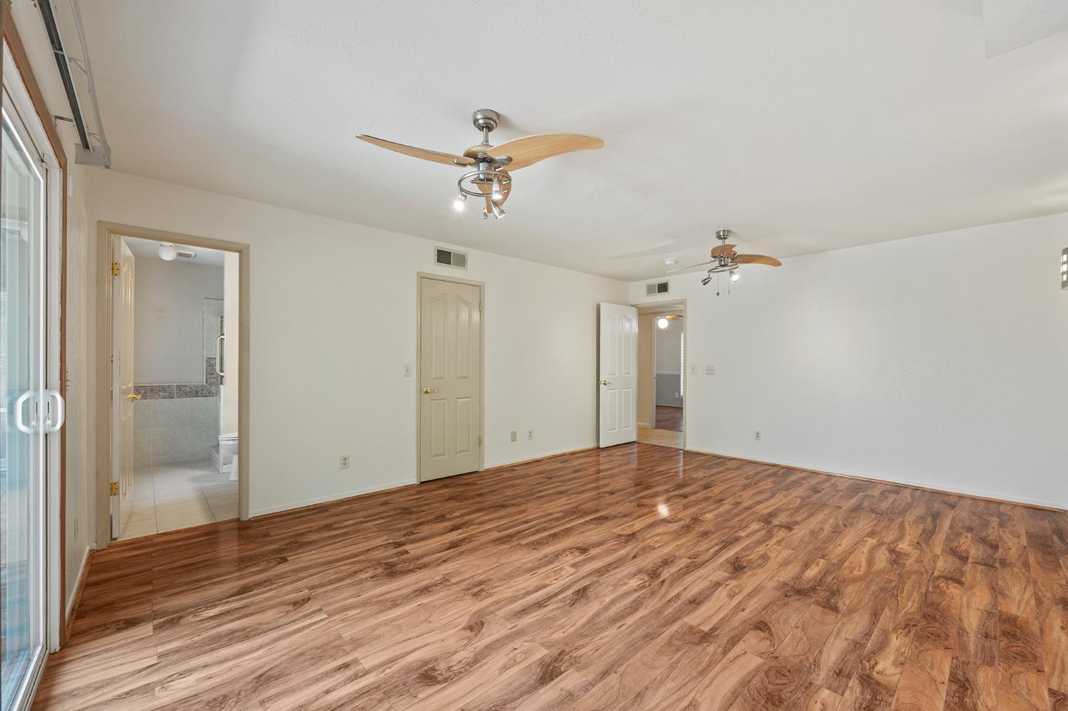 2179 Rall Avenue Clovis, CA 93611 - Photo 32 of 54 a view of empty room with wooden floor