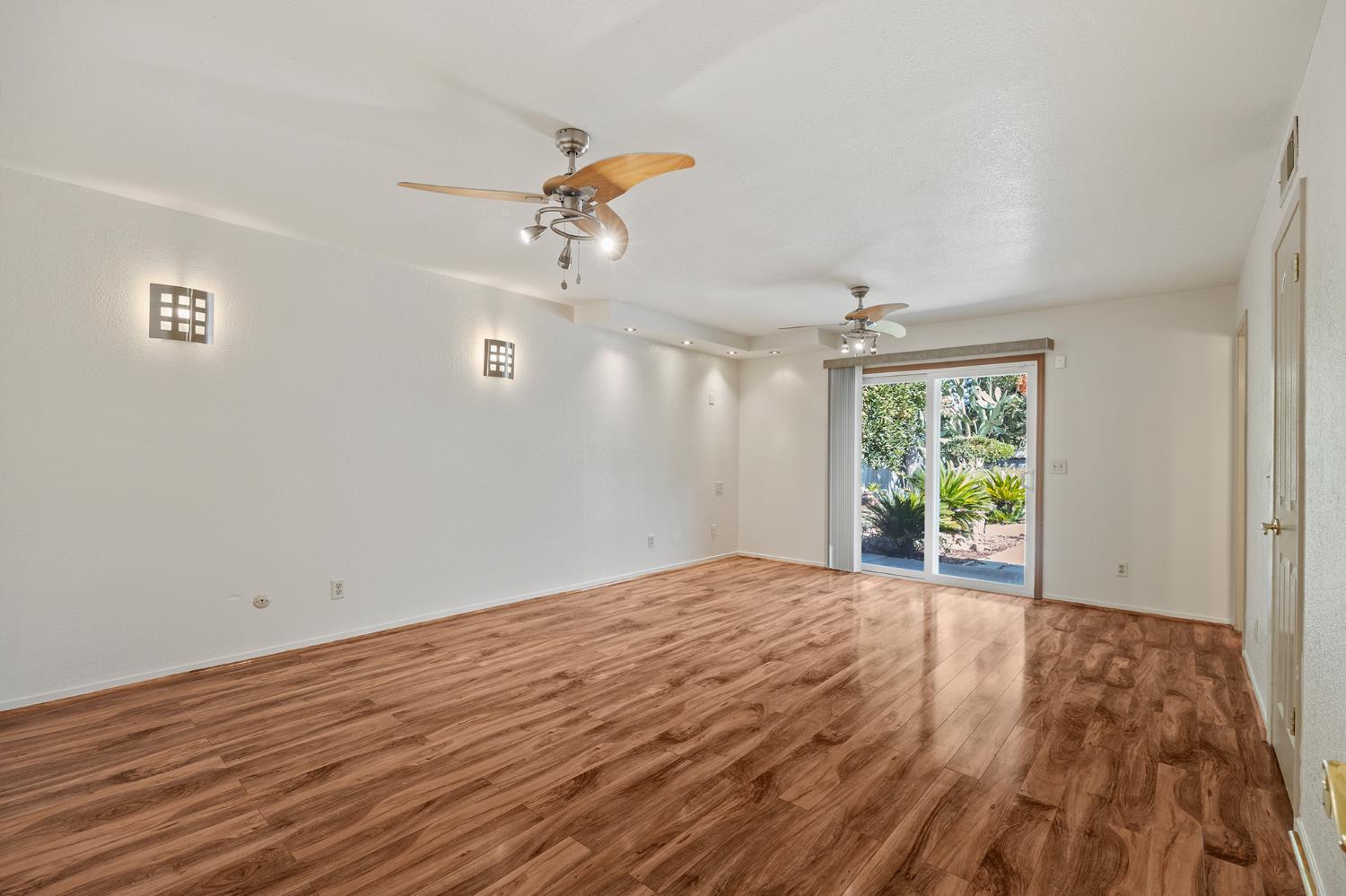 2179 Rall Avenue Clovis, CA 93611 - Photo 33 of 54 a view of empty room with wooden floor and fan