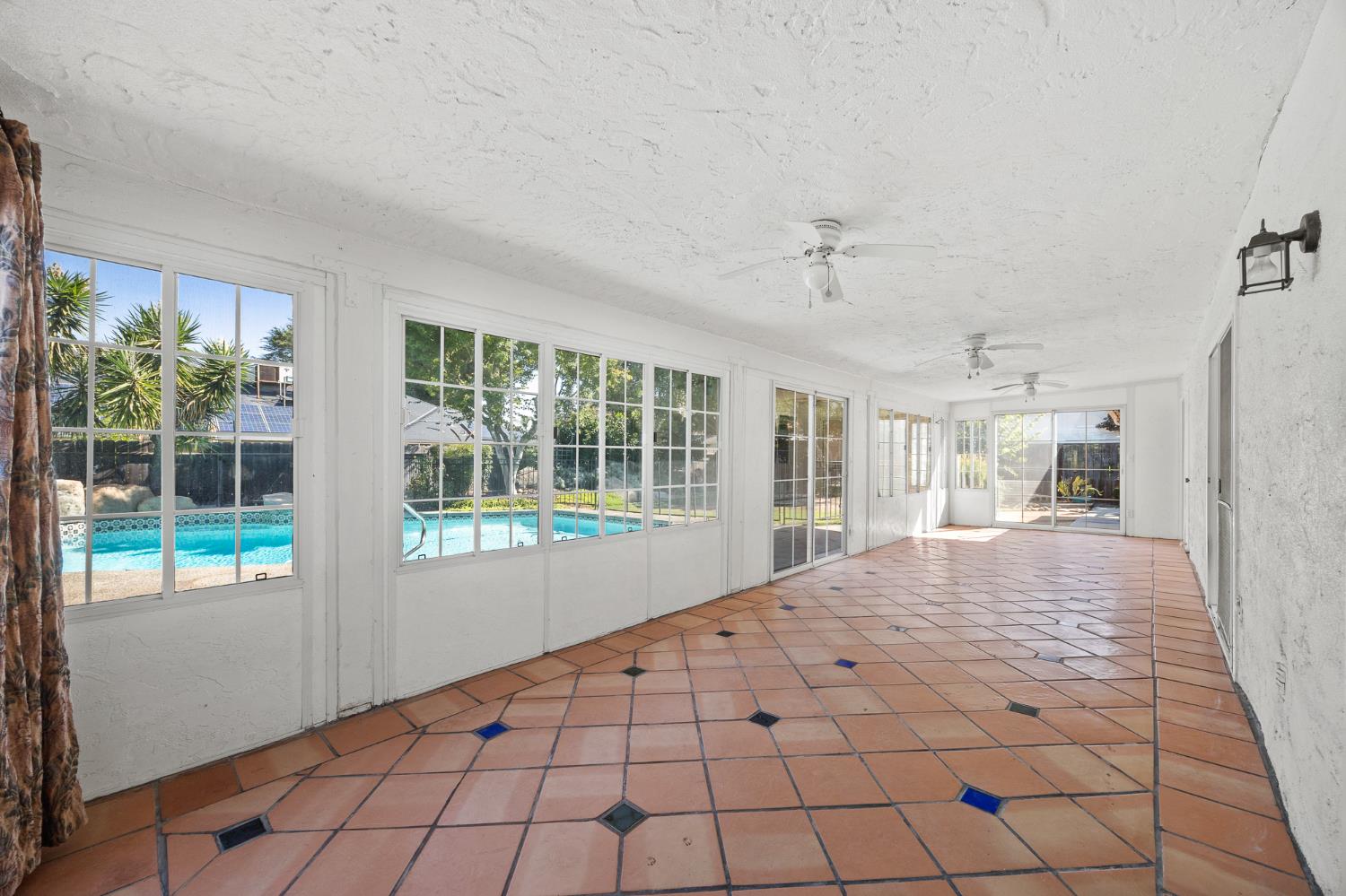 2179 Rall Avenue Clovis, CA 93611 - Photo 38 of 54 a large bedroom with natural light and hardwood