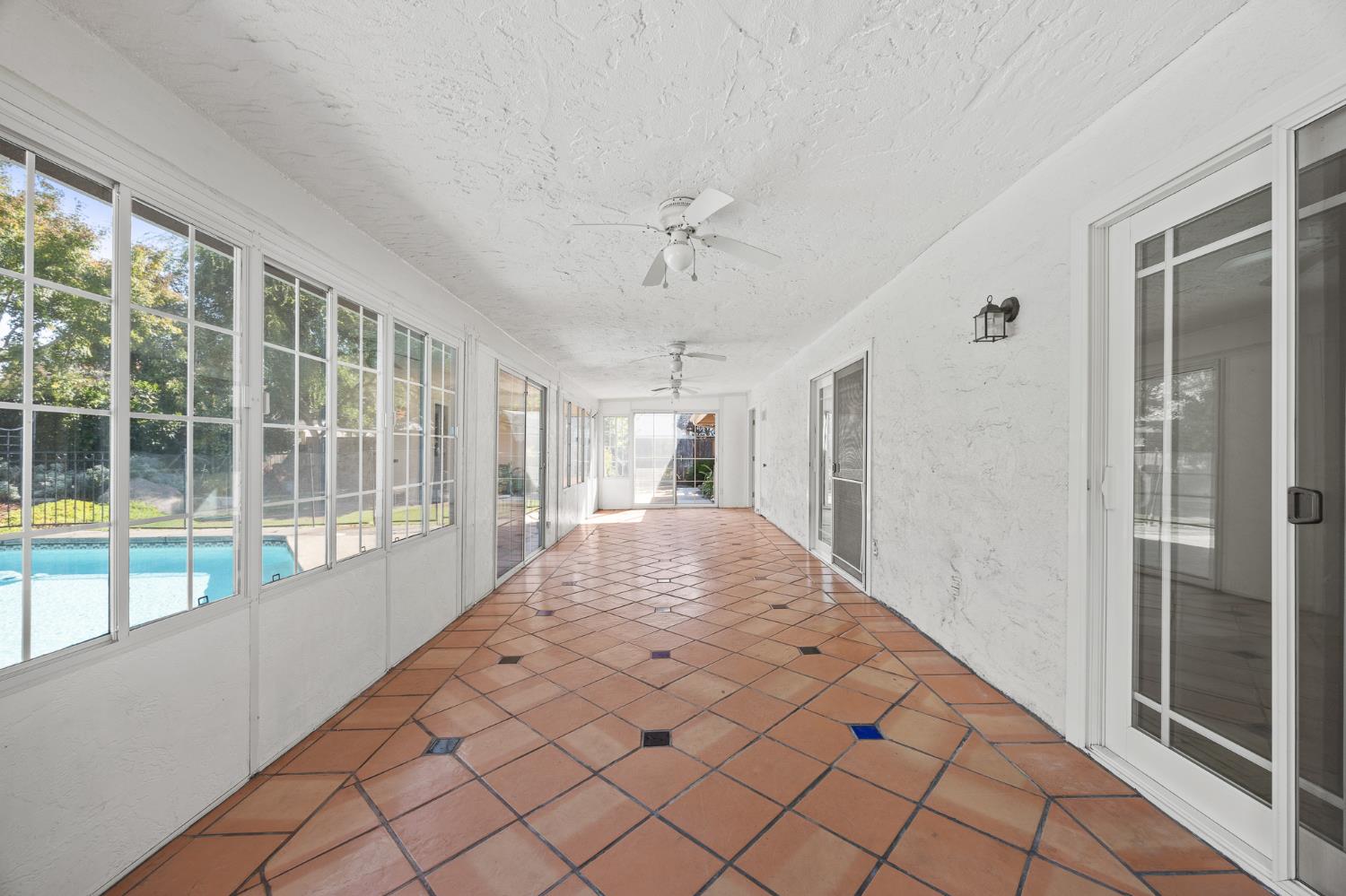 2179 Rall Avenue Clovis, CA 93611 - Photo 39 of 54 a large white room with a large window and chandelier