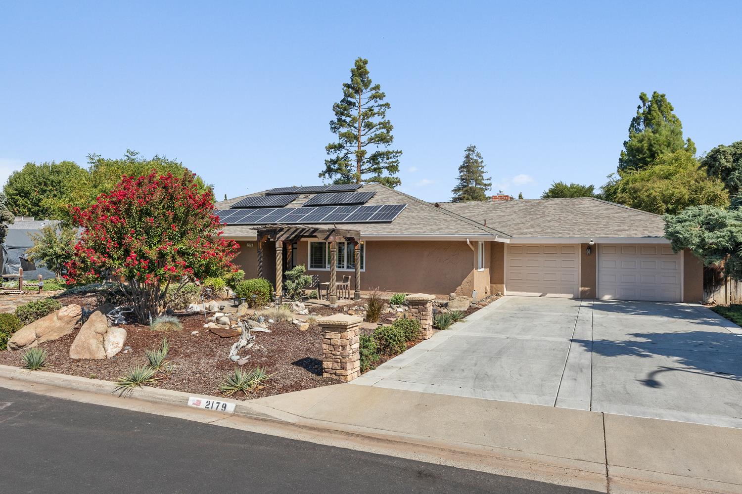 2179 Rall Avenue Clovis, CA 93611 - Photo 4 of 54 front view of a house with a yard