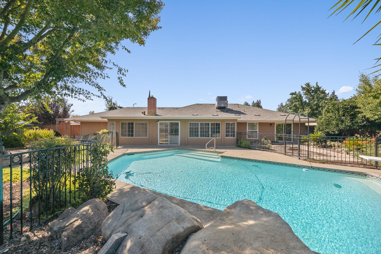 2179 Rall Avenue Clovis, CA 93611 - Photo 41 of 54 a front view of a house with garden