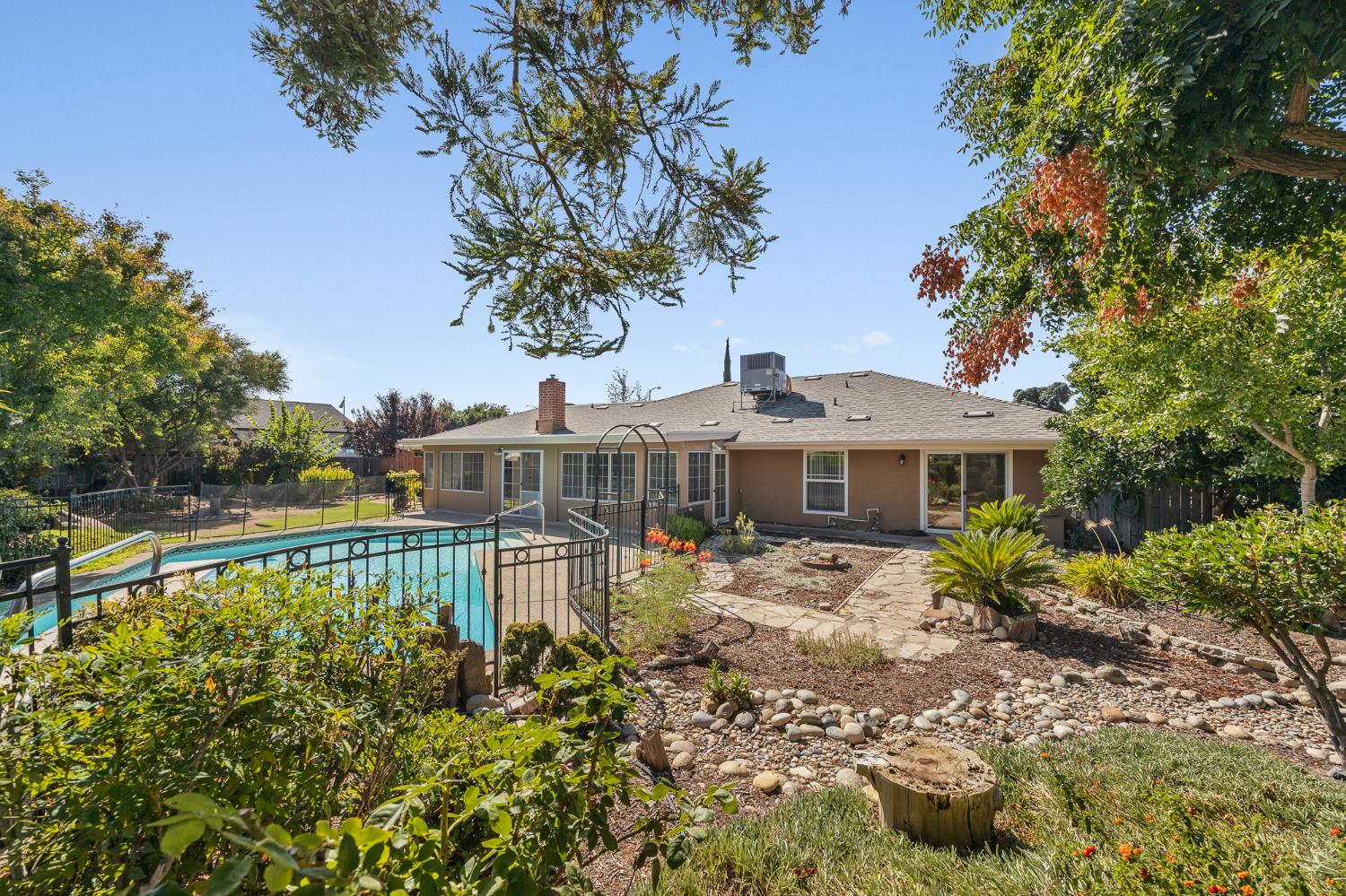 2179 Rall Avenue Clovis, CA 93611 - Photo 42 of 54 a view of a house with garden and trees