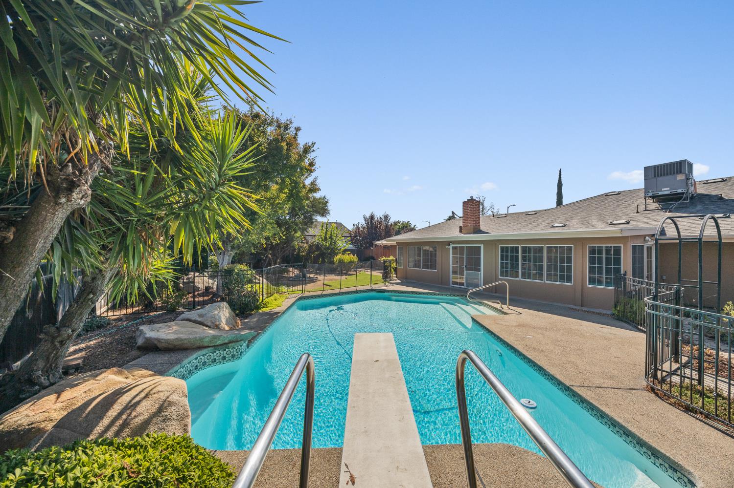 2179 Rall Avenue Clovis, CA 93611 - Photo 45 of 54 a view of a house with pool and chairs