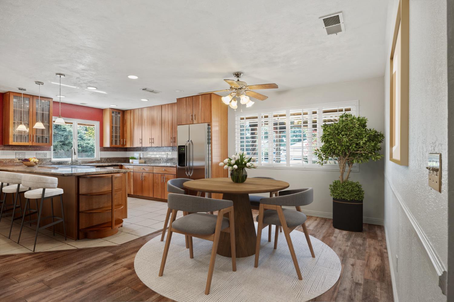 2179 Rall Avenue Clovis, CA 93611 - Photo 50 of 54 a kitchen with granite countertop white cabinets and stainless steel appliances
