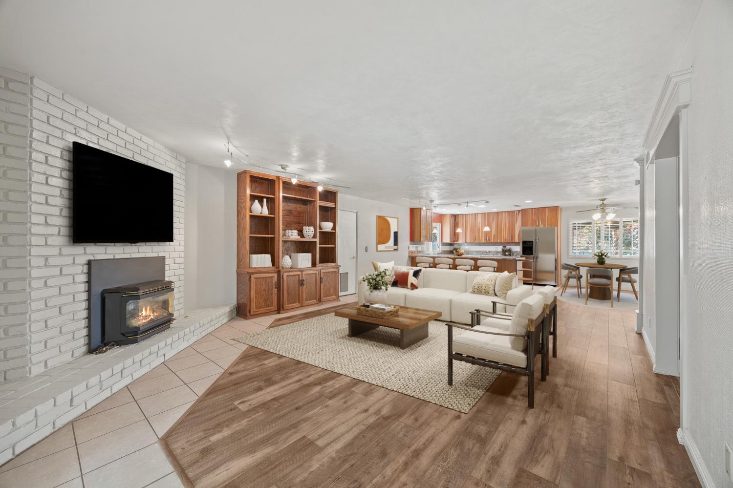 2179 Rall Avenue Clovis, CA 93611 - Photo 52 of 54 a living room with furniture a flat screen tv and a fireplace