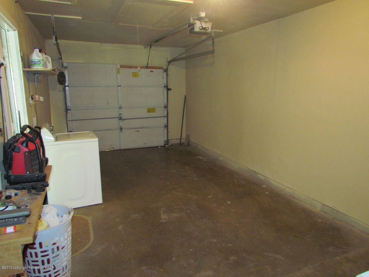 5313 Parker Street Amarillo, TX 79110 - Photo 11 of 26 a view of storage and utility room with empty racks