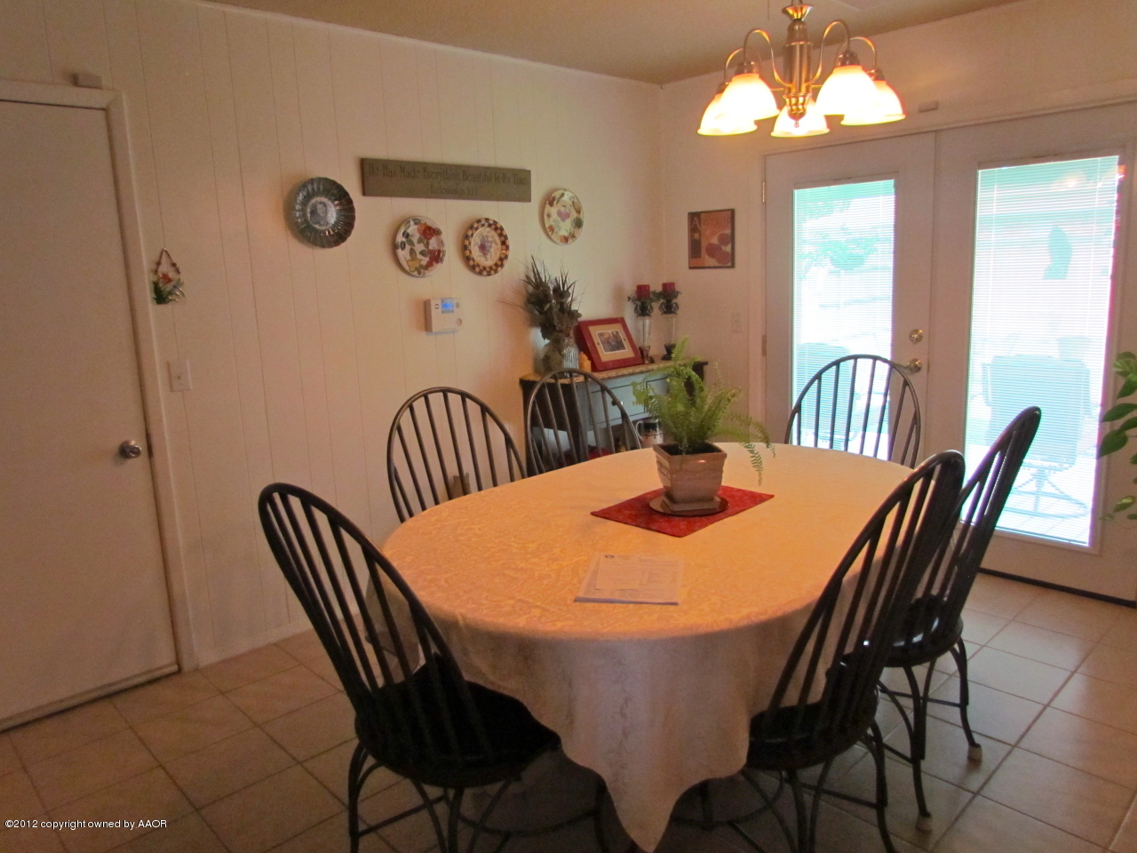 5313 Parker Street Amarillo, TX 79110 - Photo 14 of 26 a view of a dining room with furniture and chandelier