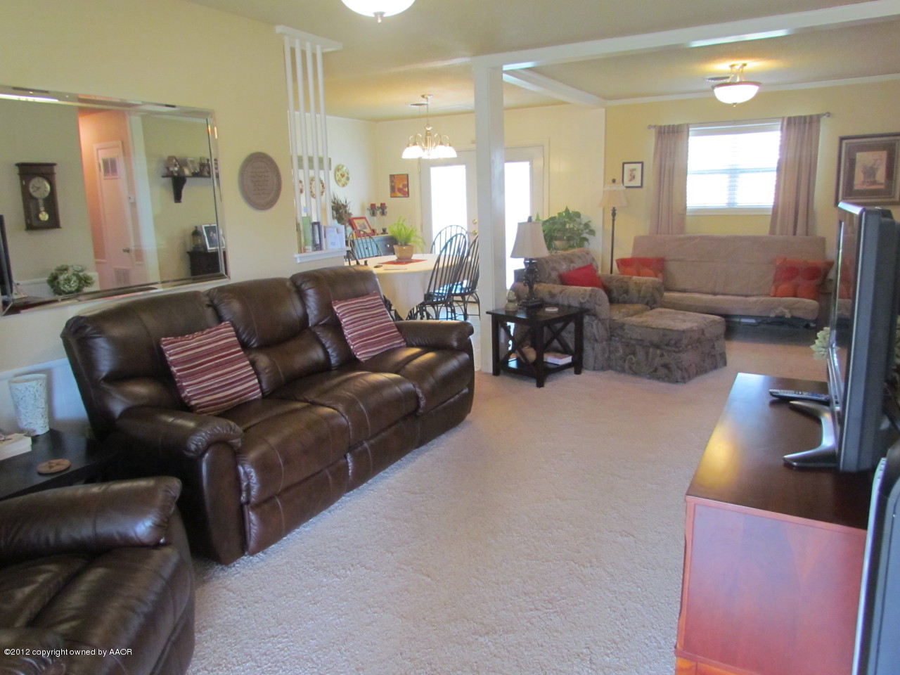 5313 Parker Street Amarillo, TX 79110 - Photo 6 of 26 a living room with furniture and wooden floor