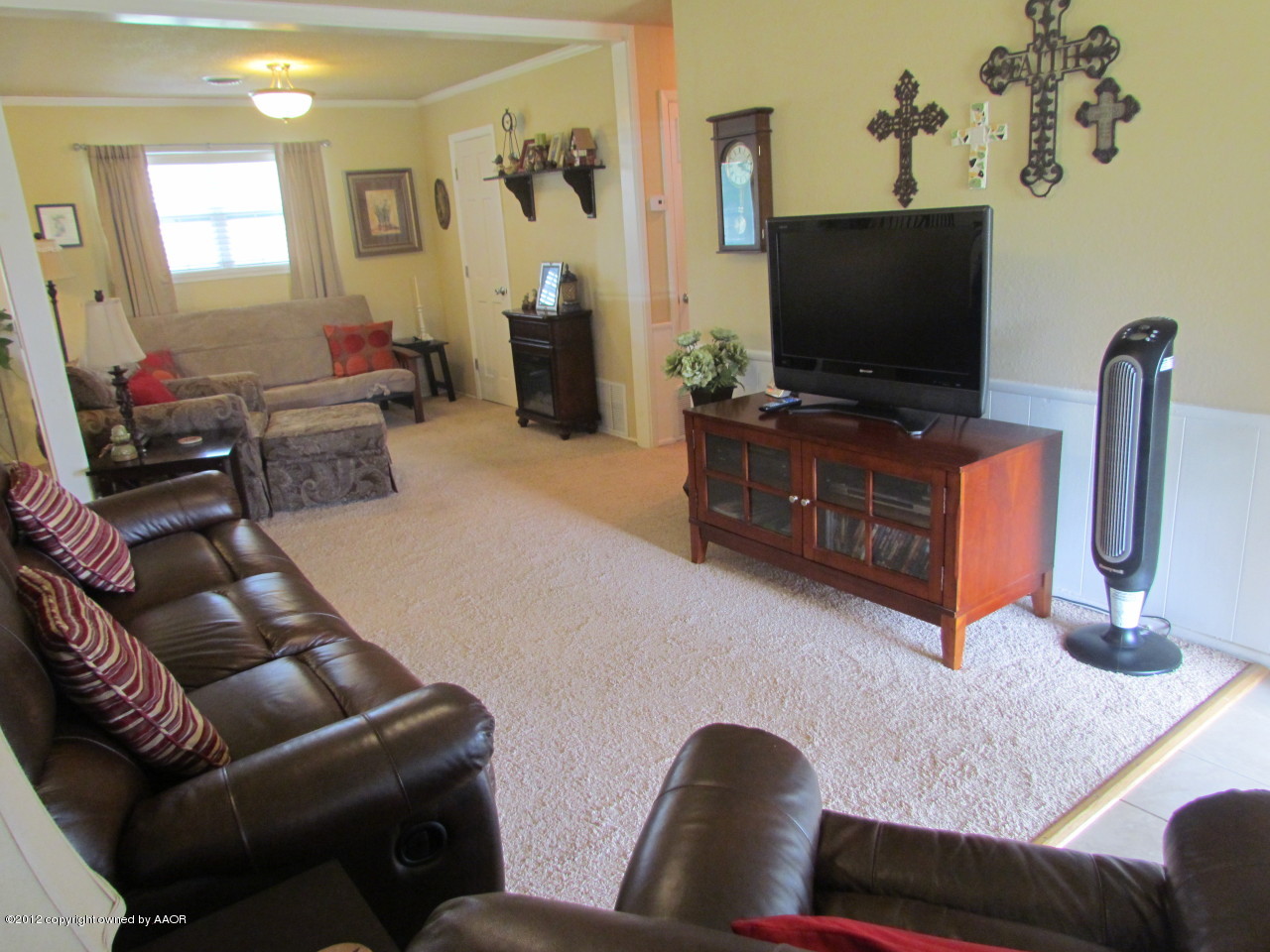 5313 Parker Street Amarillo, TX 79110 - Photo 7 of 26 a living room with furniture and a flat screen tv