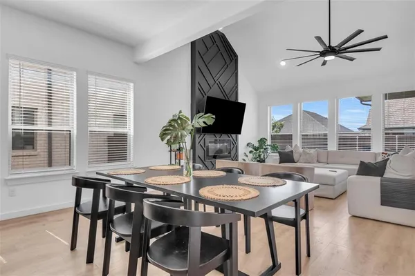 a view of a dining room with furniture window and wooden floor