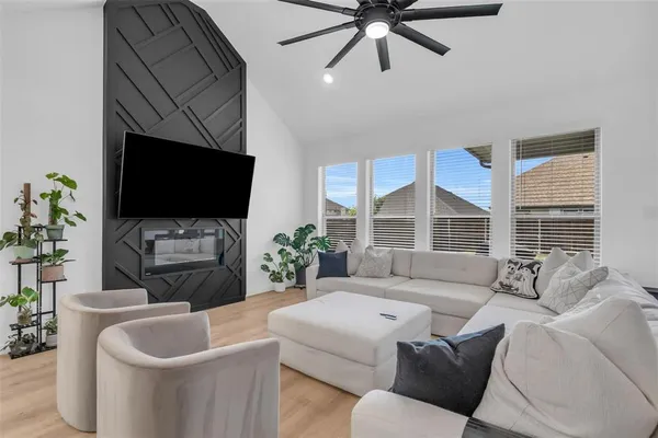 a living room with furniture and a flat screen tv