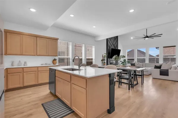 a kitchen with lots of counter top space and dining table