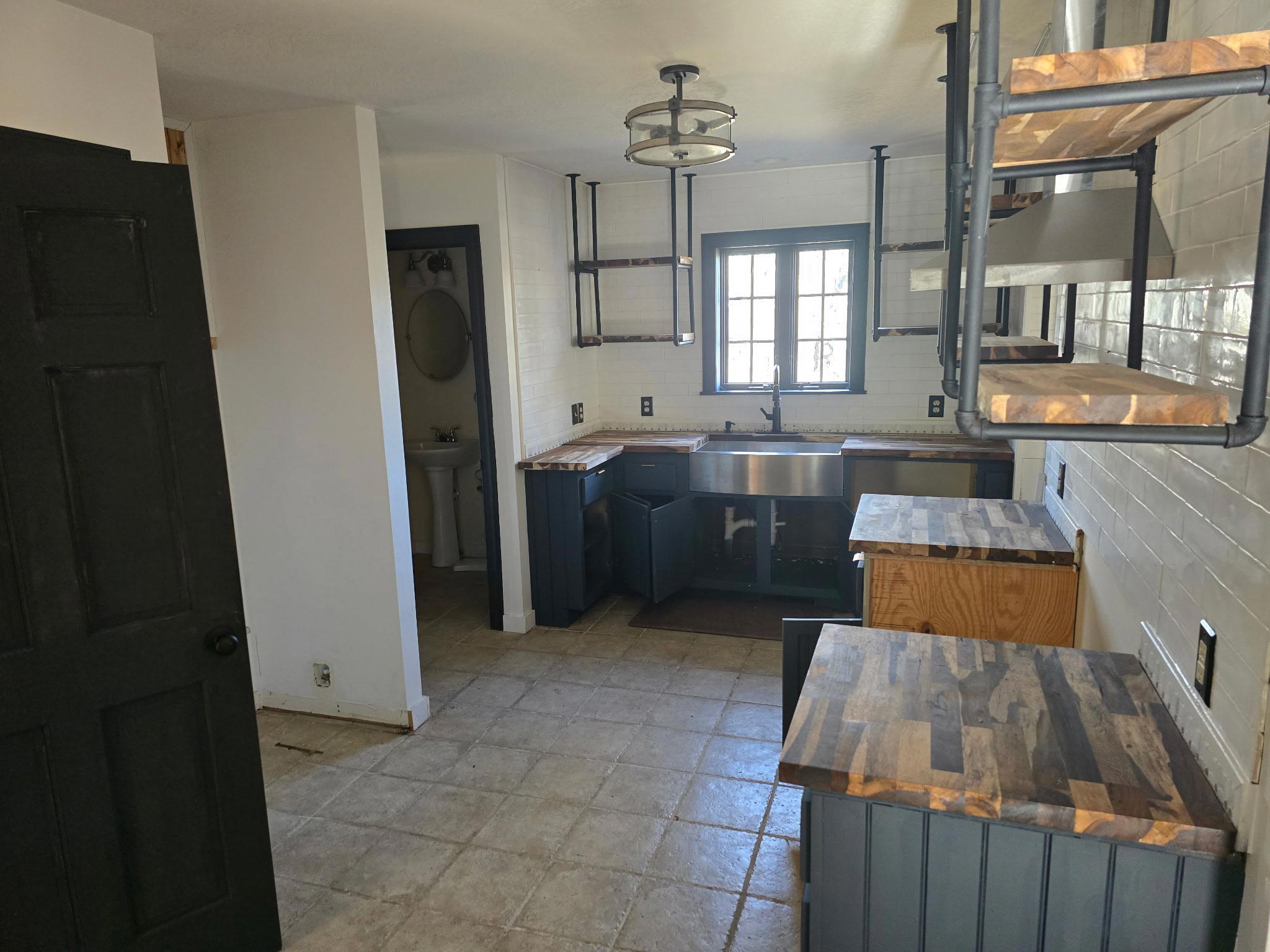 102 Flint Ridge Trail Fancy Gap, VA 24328 - Photo 13 of 26 a kitchen with granite countertop a sink dishwasher stove and refrigerator