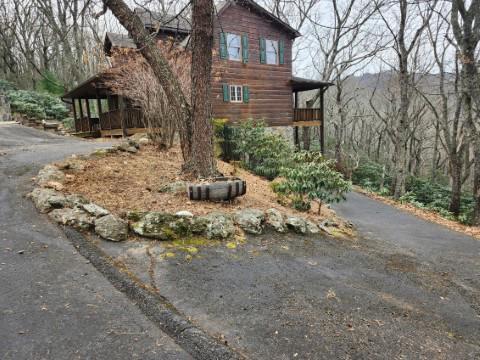 102 Flint Ridge Trail Fancy Gap, VA 24328 - Photo 2 of 26 a view of a house with a yard covered in snow