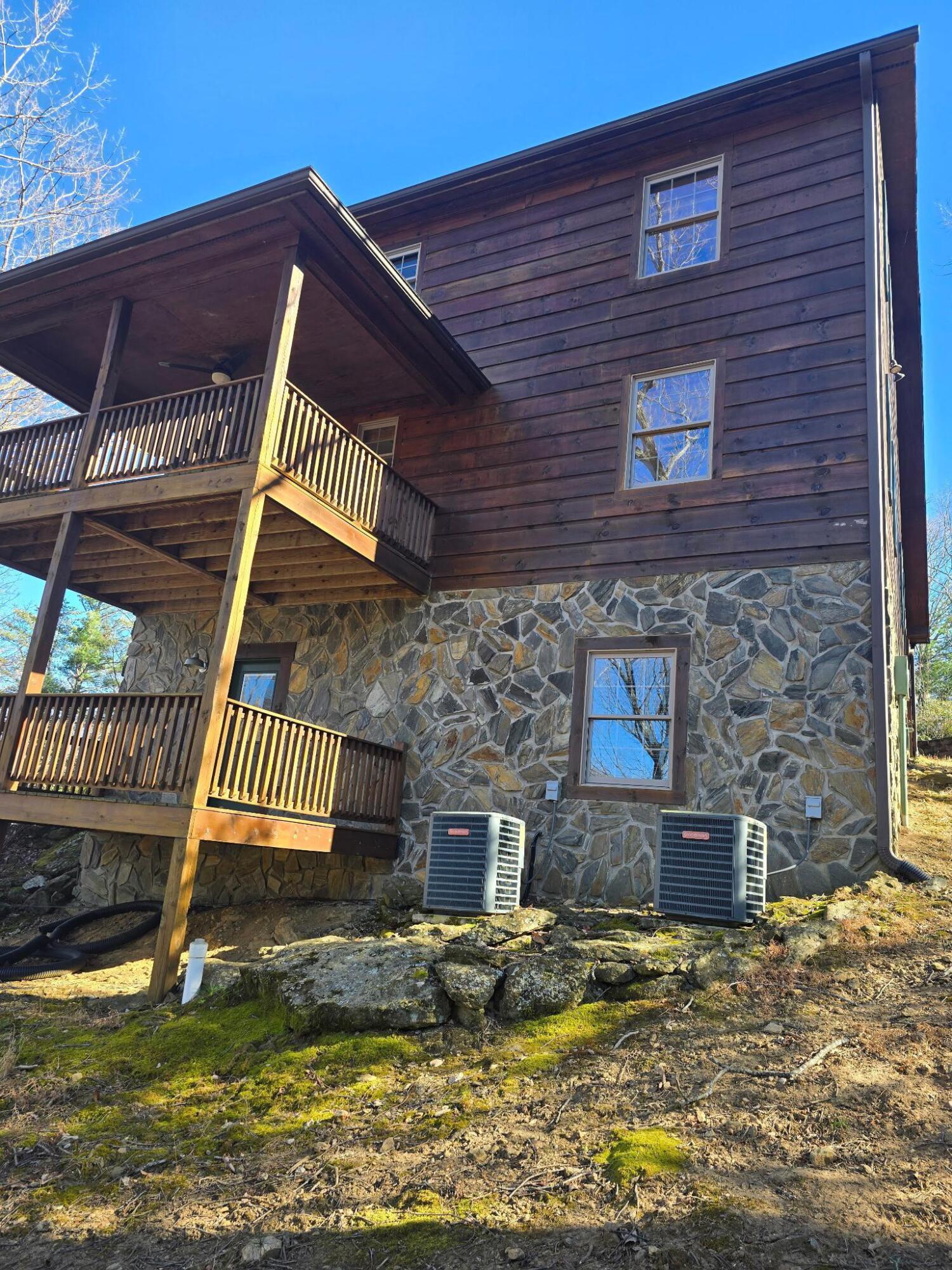 102 Flint Ridge Trail Fancy Gap, VA 24328 - Photo 9 of 26 a front view of a house with a yard