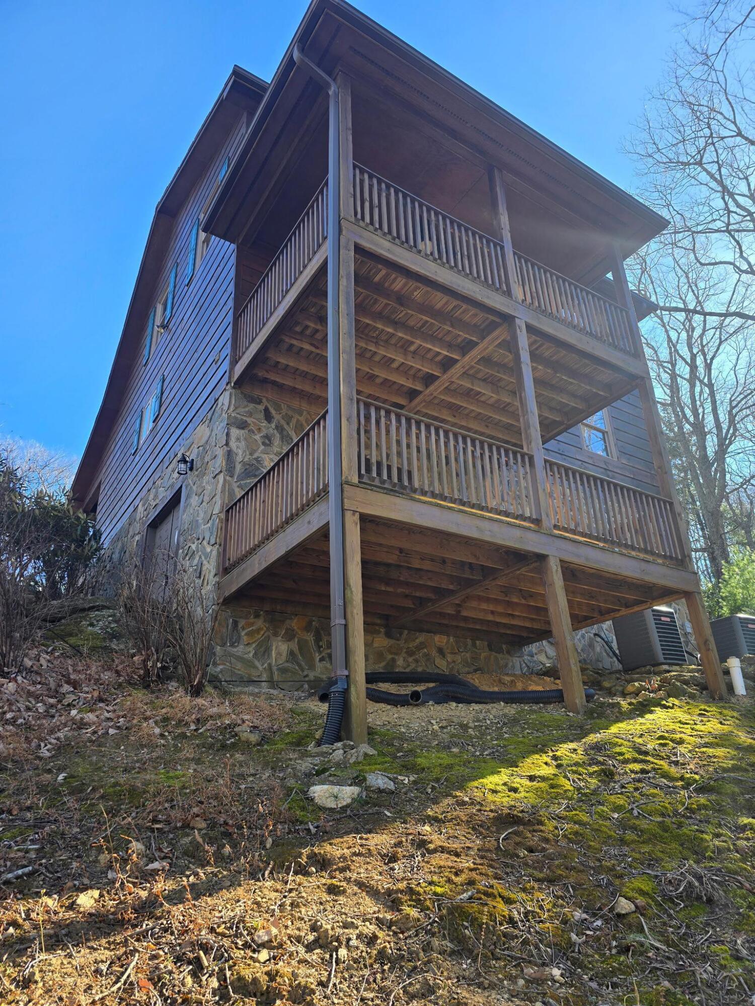 102 Flint Ridge Trail Fancy Gap, VA 24328 - Photo 10 of 26 a view of a house with a yard