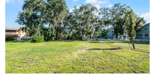 a view of outdoor space with deck and trees