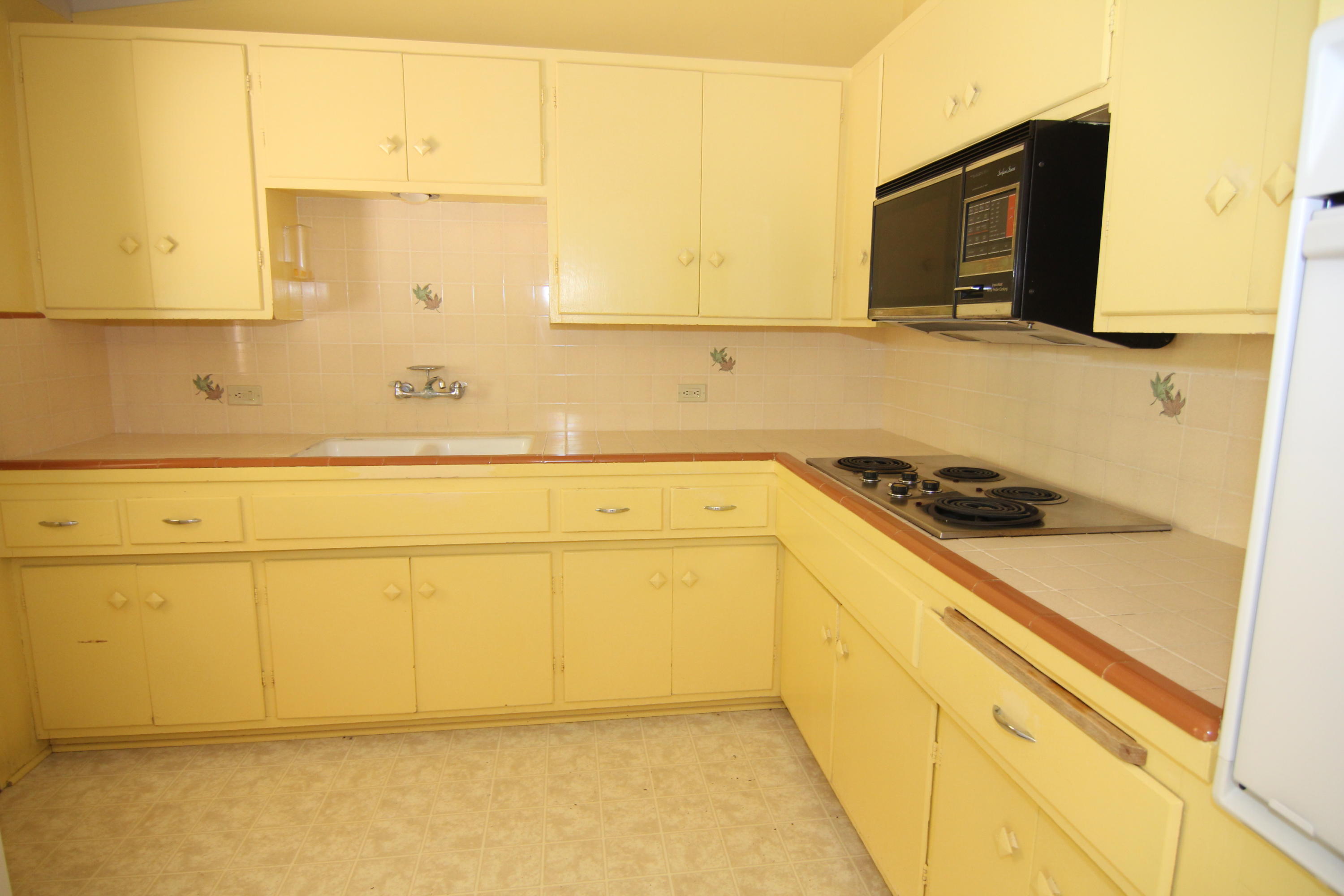 912 Fellowship Road Santa Barbara, CA 93109 - Photo 6 of 16 a bathroom with a sink and a washing machine