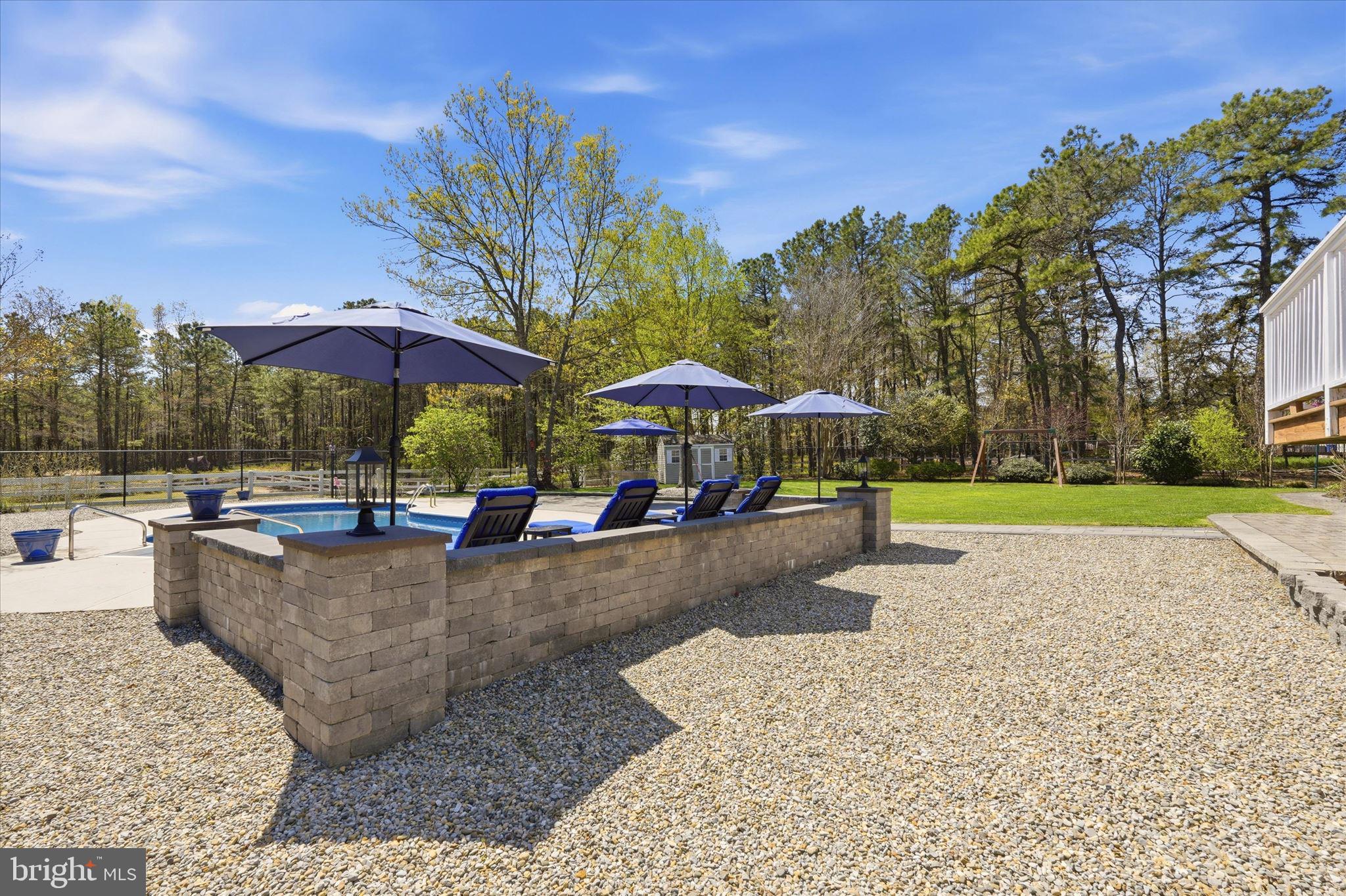 176 Warren Grove Road Barnegat, NJ 08005 - Photo 50 of 71 a view of a swimming pool with lounge chair