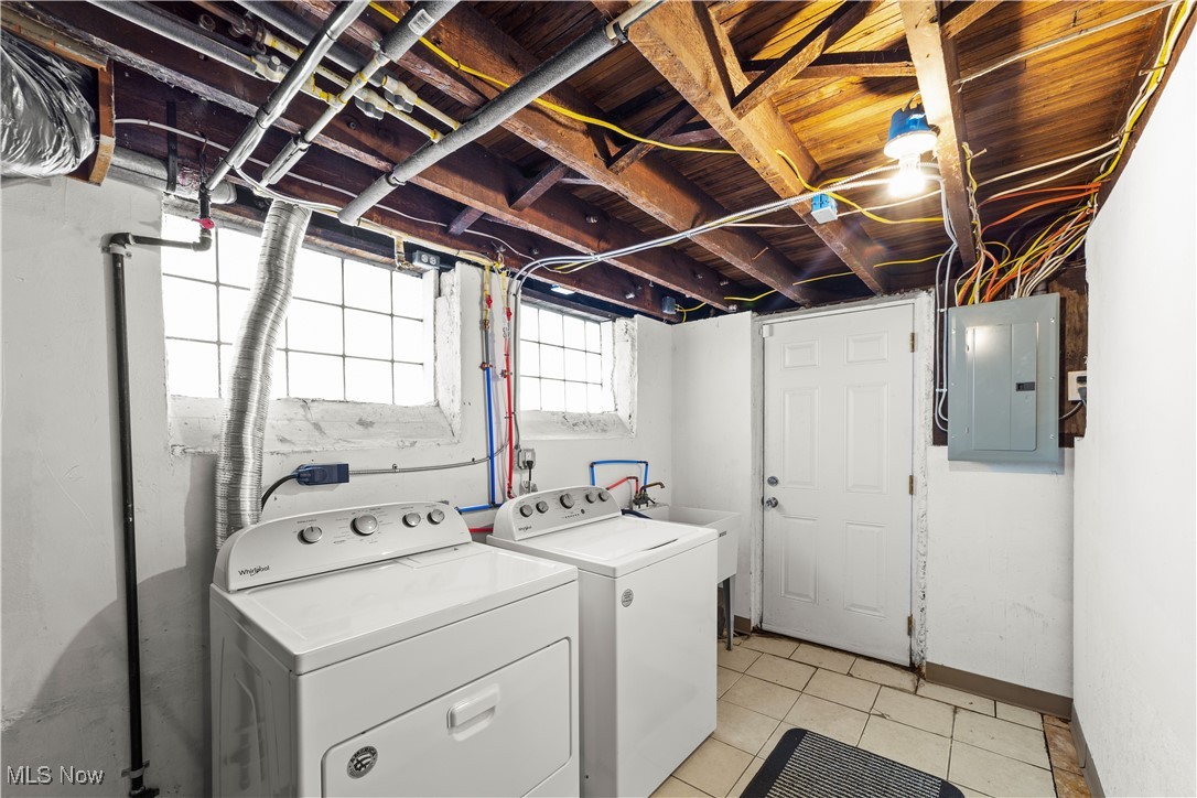 14420 Superior Road Cleveland, OH 44118 - Photo 38 of 44 Laundry room with washer and dryer, electric panel, and light tile patterned flooring
