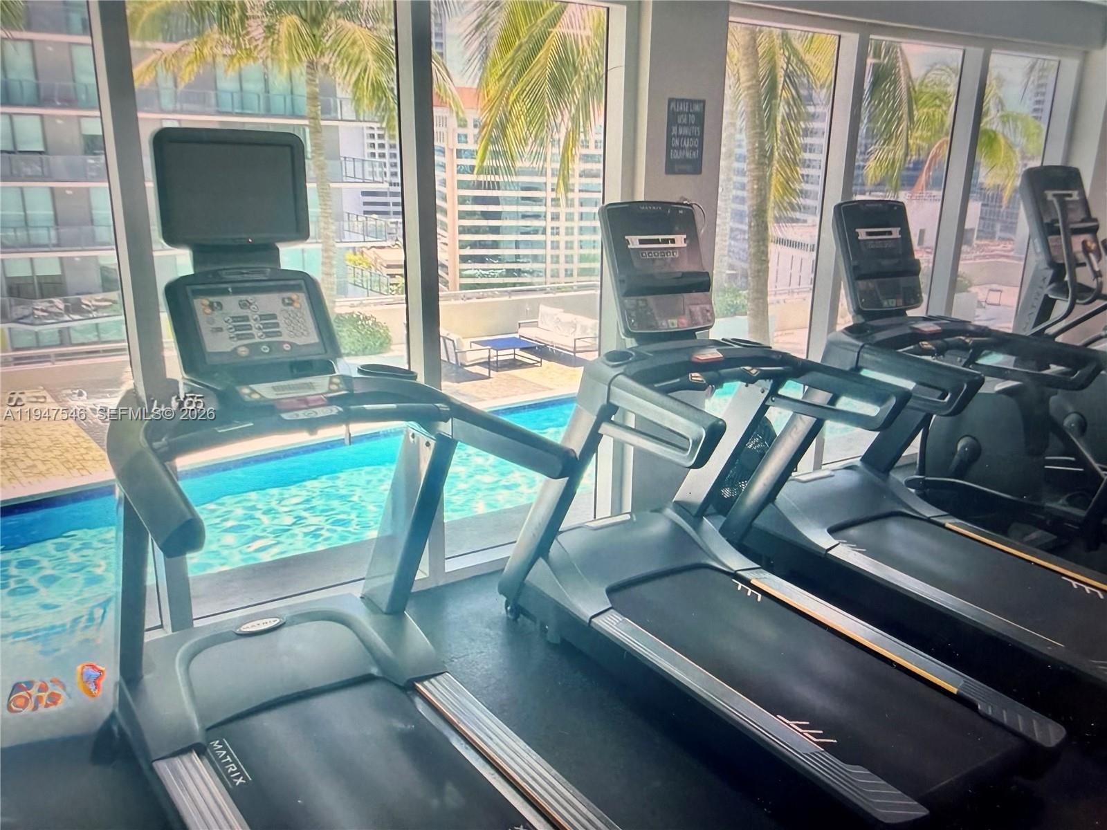 60 Southwest 13th Street, Unit 3214 Miami, FL 33130 - Photo 12 of 13 a view of living room with furniture and floor to ceiling windows