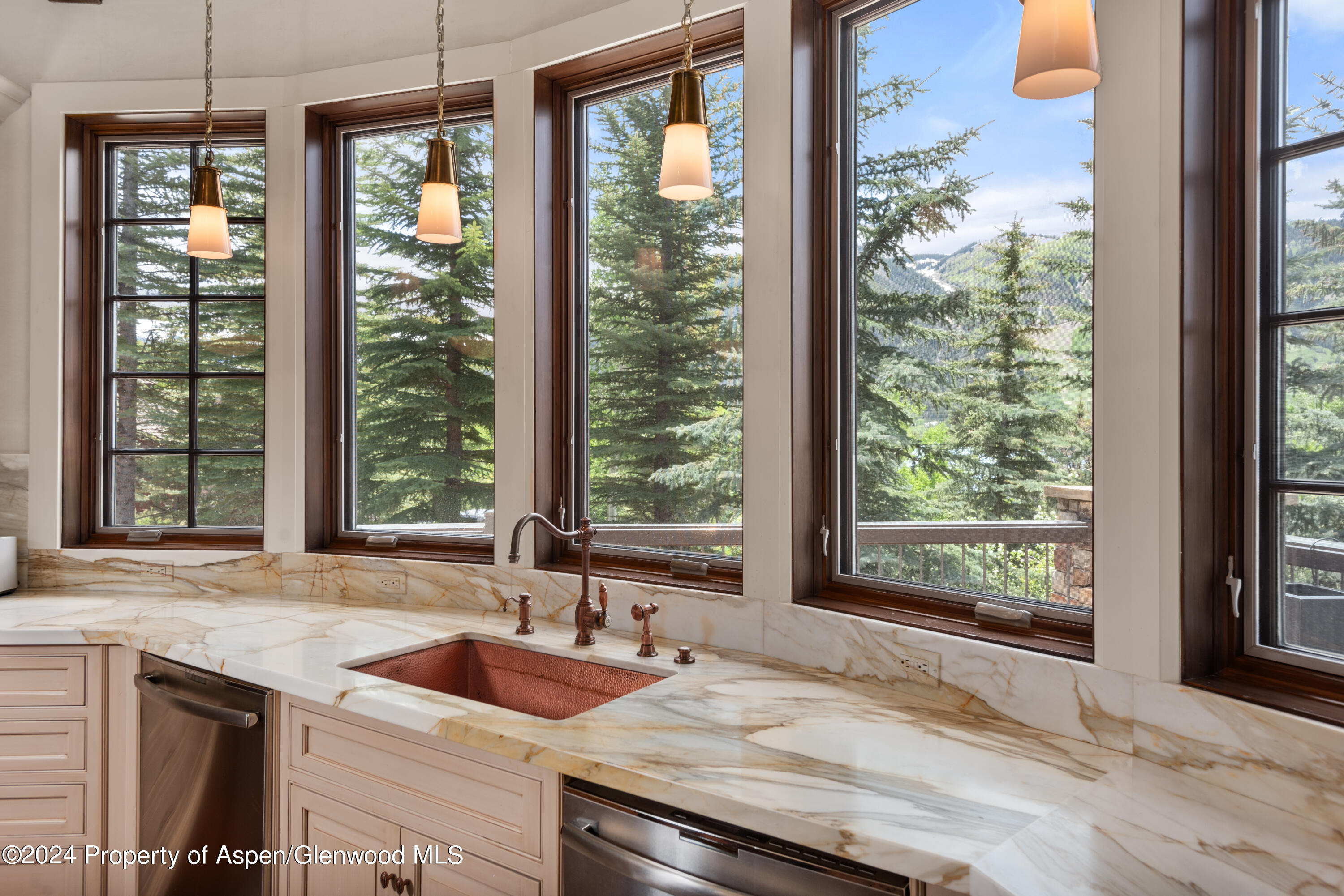 705 Spruce Street Aspen, CO 81611 - Photo 15 of 44 a kitchen with granite countertop sink and natural light