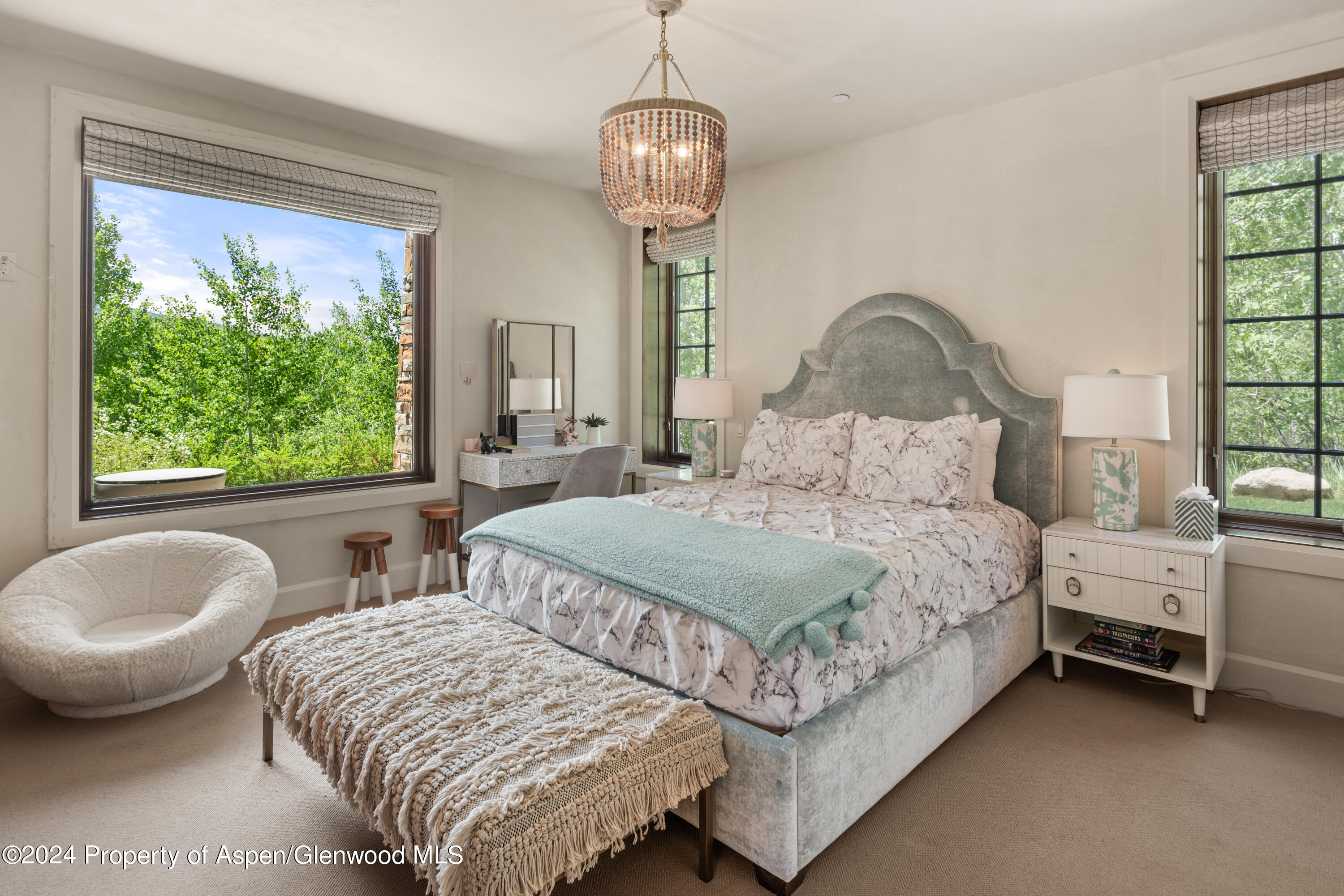 705 Spruce Street Aspen, CO 81611 - Photo 20 of 44 a bedroom with two beds and a chair