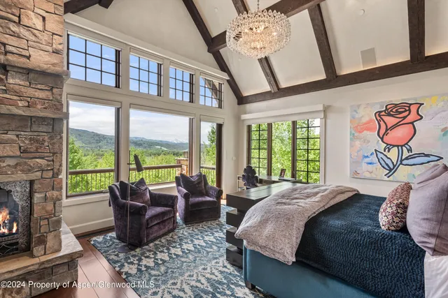 a bed room with a bed and a balcony