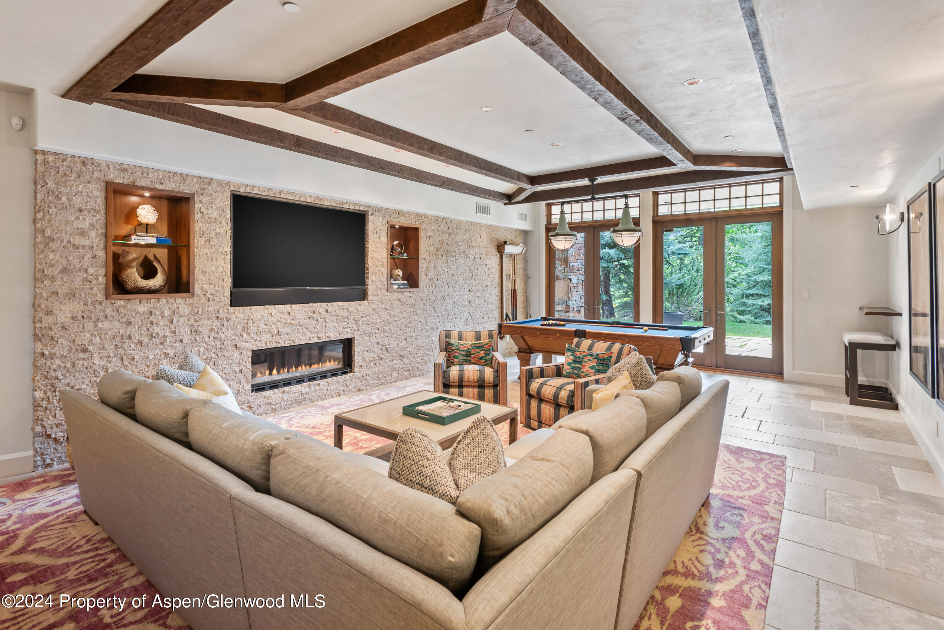 705 Spruce Street Aspen, CO 81611 - Photo 29 of 44 a living room with furniture a large window and a flat screen tv
