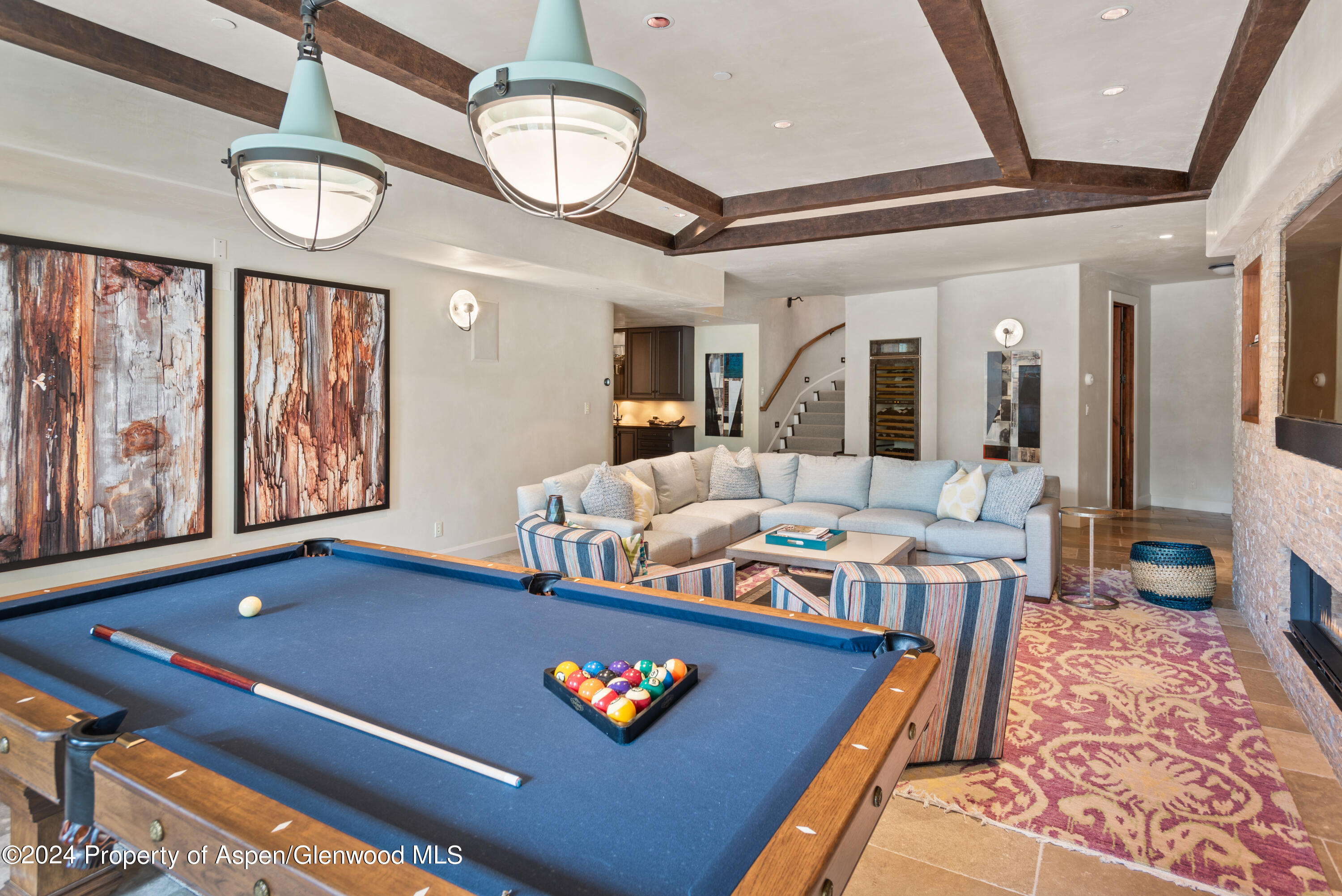 705 Spruce Street Aspen, CO 81611 - Photo 30 of 44 a living room with furniture pool table and a large window