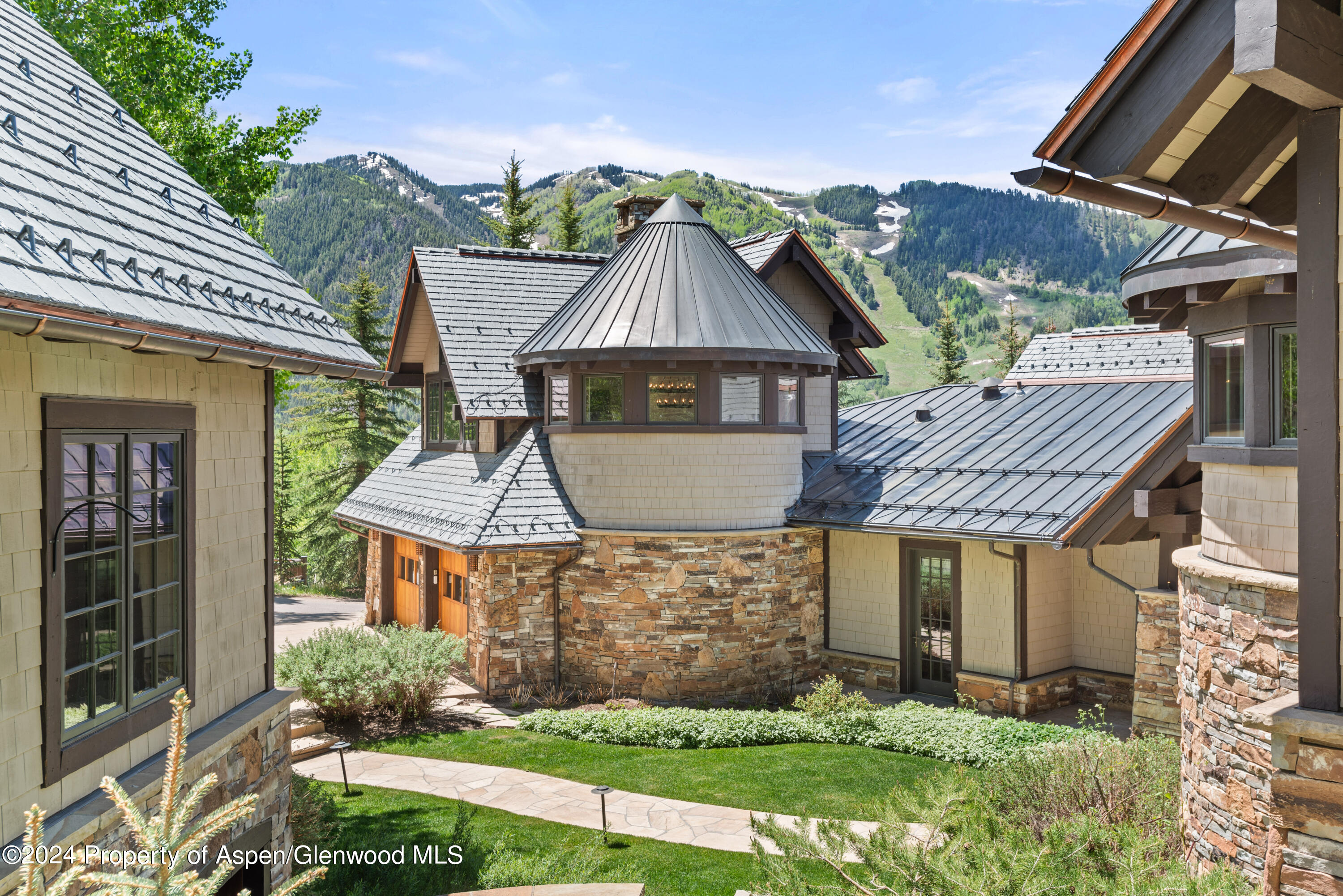 705 Spruce Street Aspen, CO 81611 - Photo 3 of 44 a front view of a house with a garden