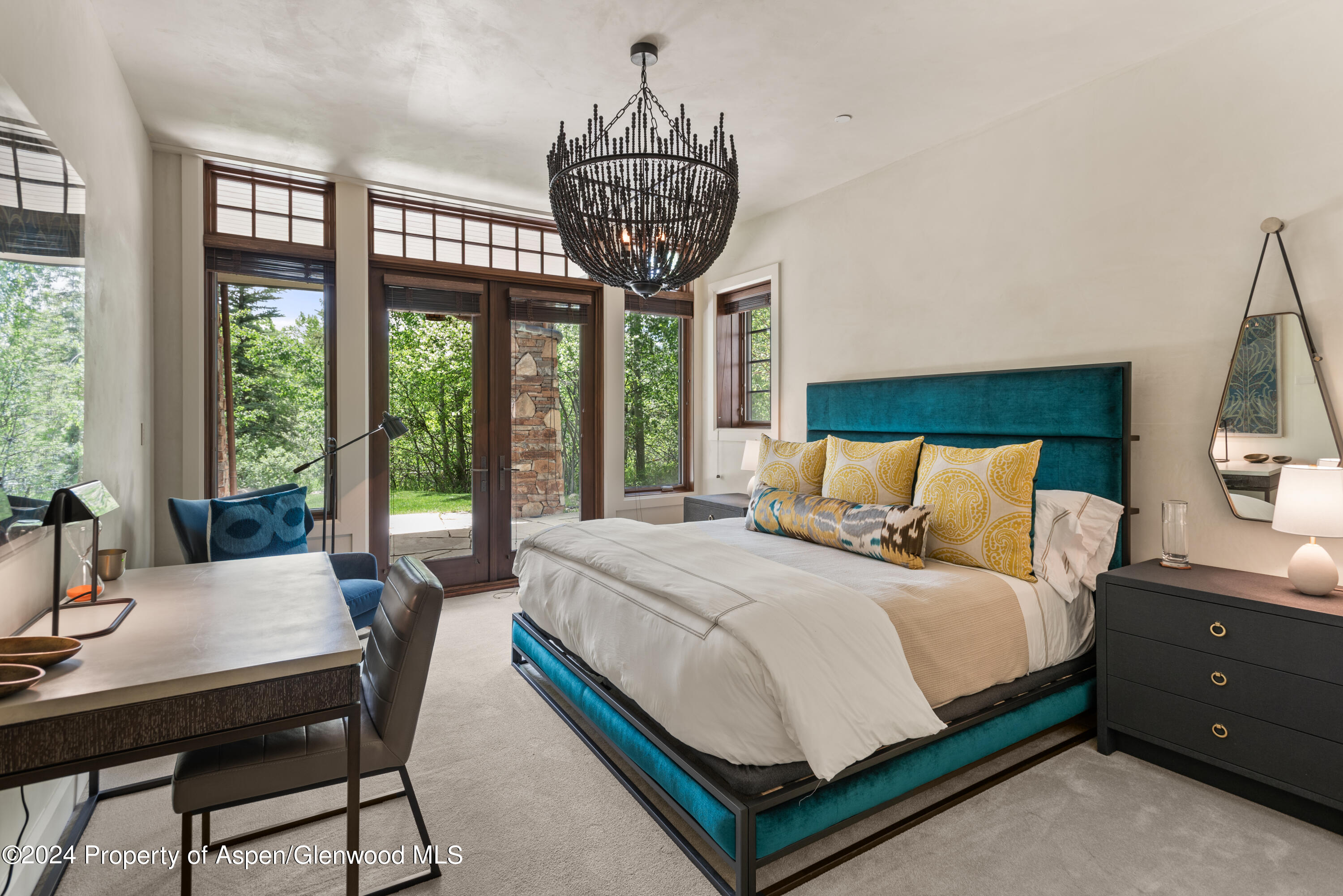 705 Spruce Street Aspen, CO 81611 - Photo 35 of 44 a large bed sitting in a bedroom next to a window