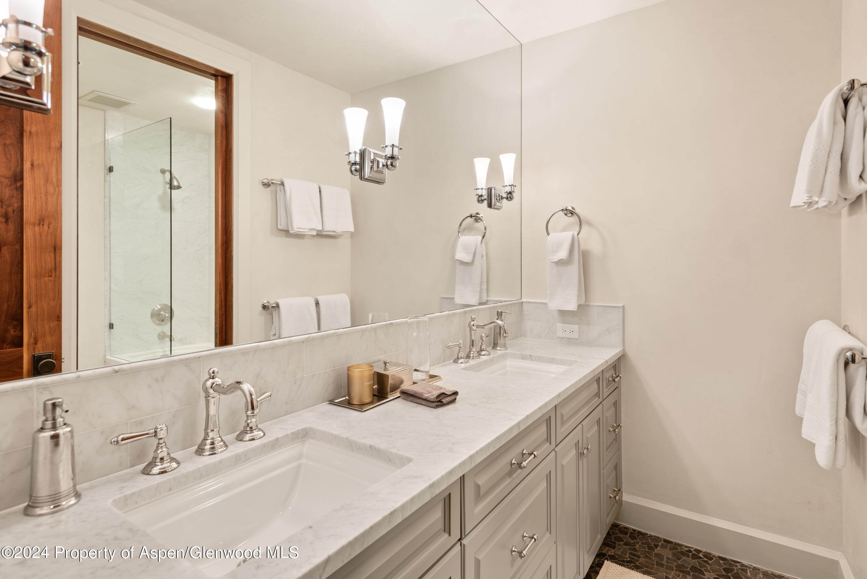 705 Spruce Street Aspen, CO 81611 - Photo 36 of 44 a bathroom with double vanity sinks and a mirror
