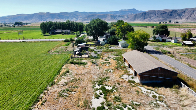630 North Main Street Monroe, UT 84754 - Photo 33 of 63 Aerial view of sparsely populated area with a mountain backdrop