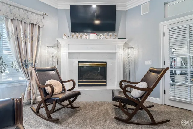 a bed room with a bed and a chair