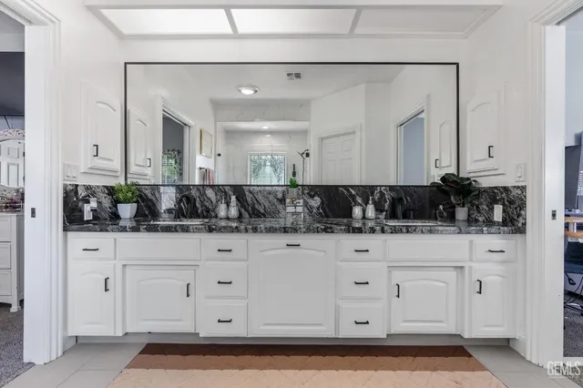a view of a livingroom with workspace and a window