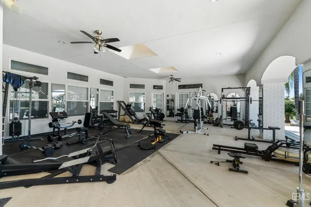 a garden with trees in the background