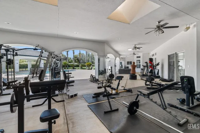 an aerial view of a house with outdoor space and a lake view