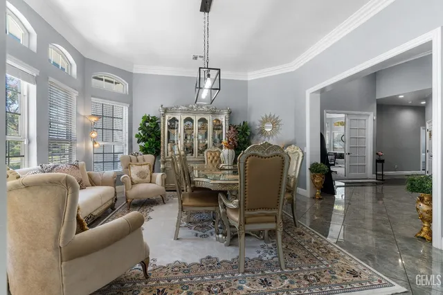 a view of a dining room with furniture window and outside view