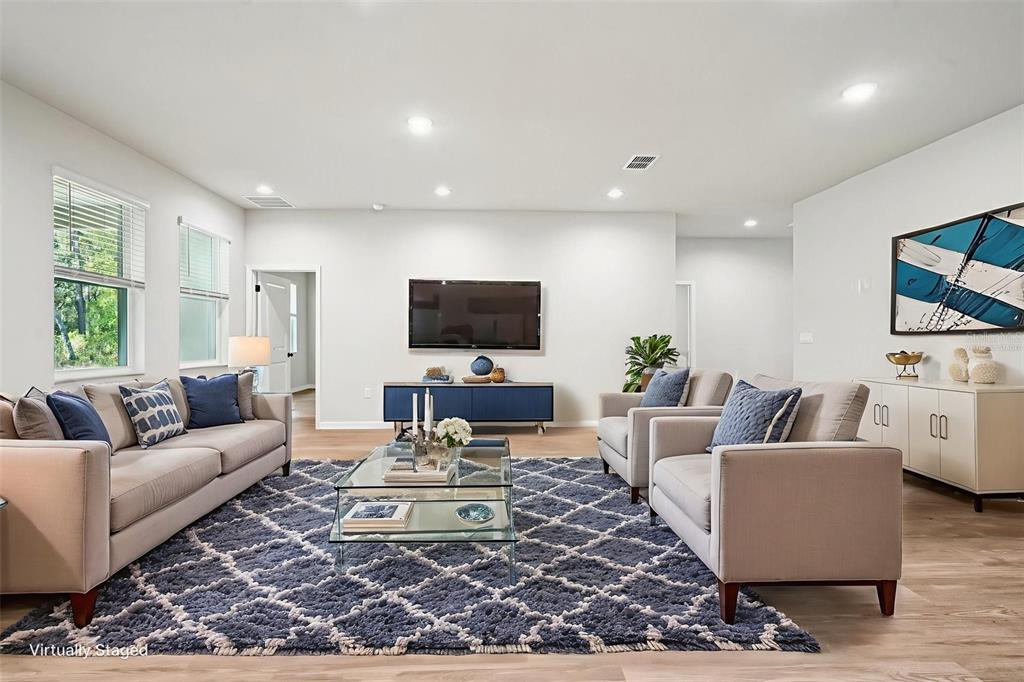 64 Cactus Street Homosassa, FL 34446 - Photo 4 of 12 a living room with furniture a rug and a flat screen tv