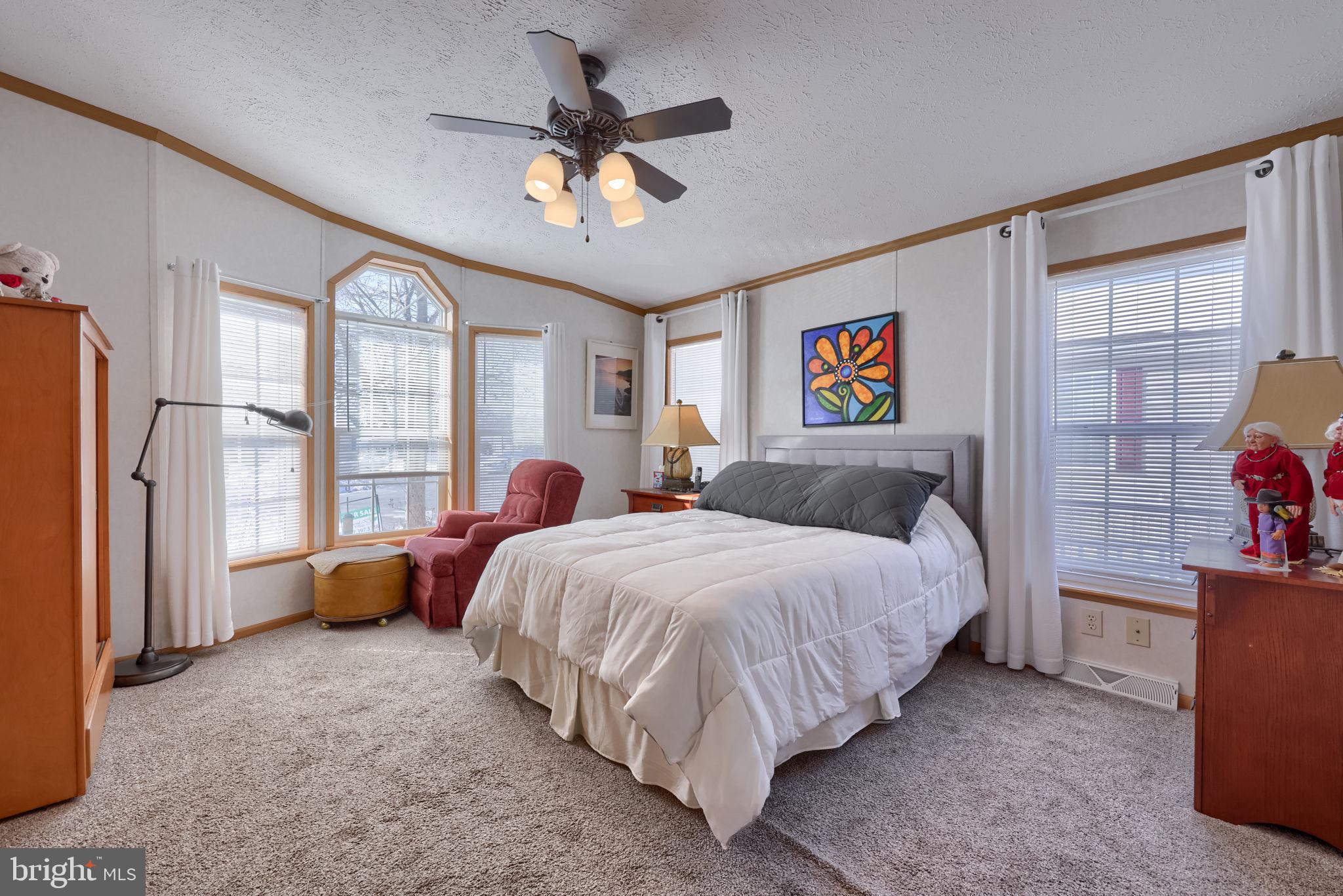 310 Summers Drive Lancaster, PA 17601 - Photo 18 of 44 a bed room with a bed and a chandelier