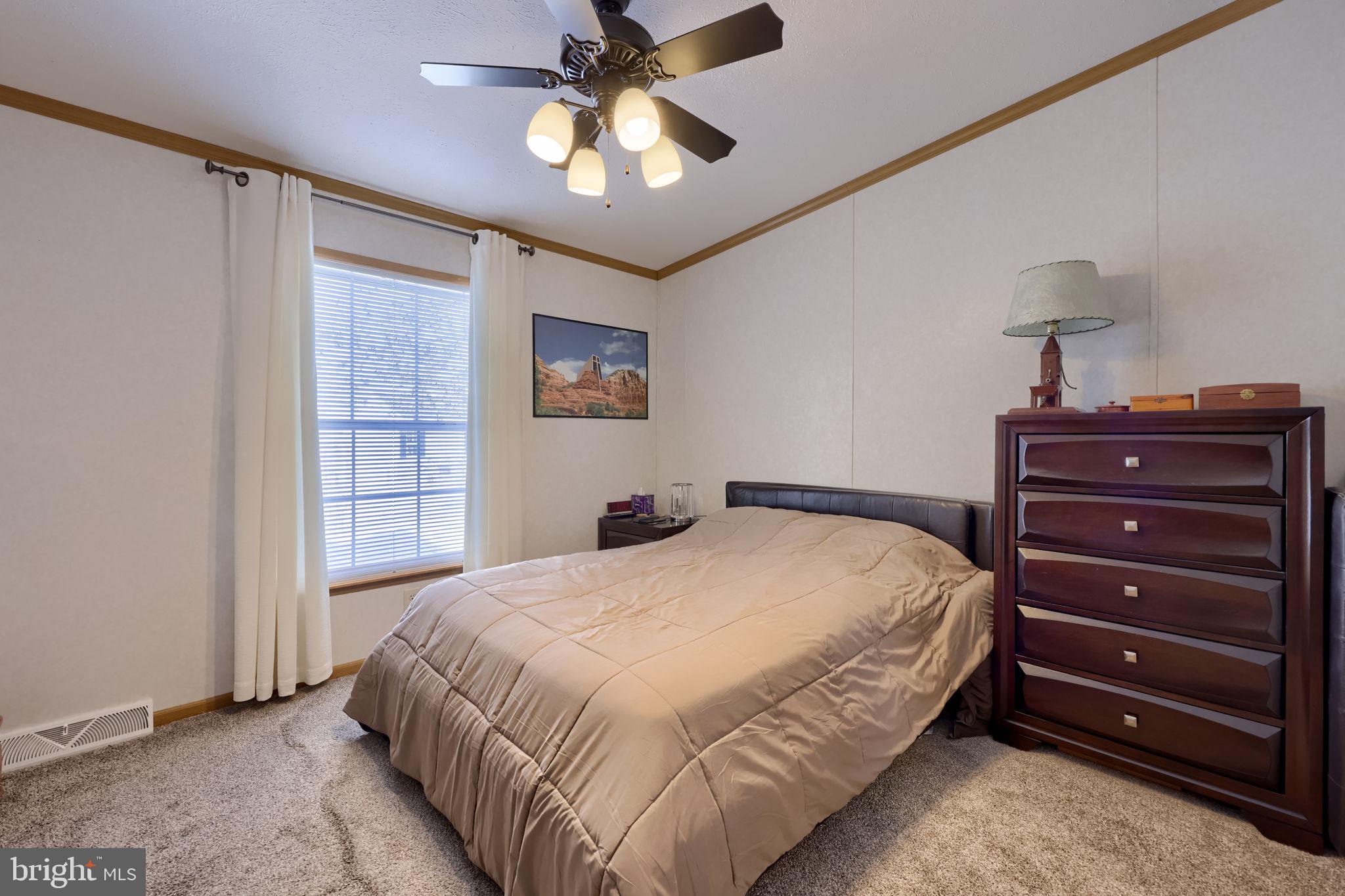 310 Summers Drive Lancaster, PA 17601 - Photo 22 of 44 a bedroom with a bed and a chandelier