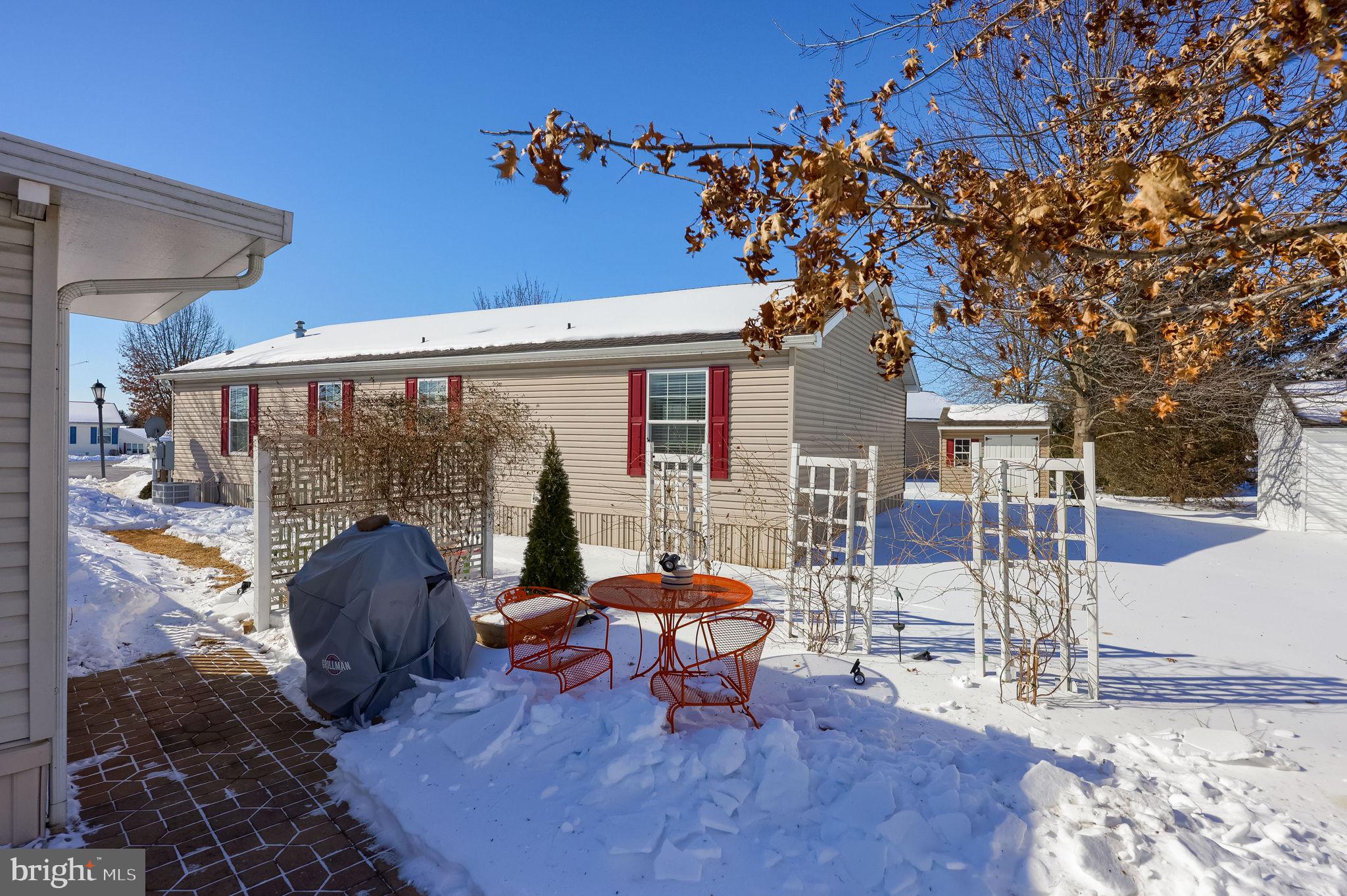 310 Summers Drive Lancaster, PA 17601 - Photo 30 of 44 a view of a patio with table and chairs and potted plants
