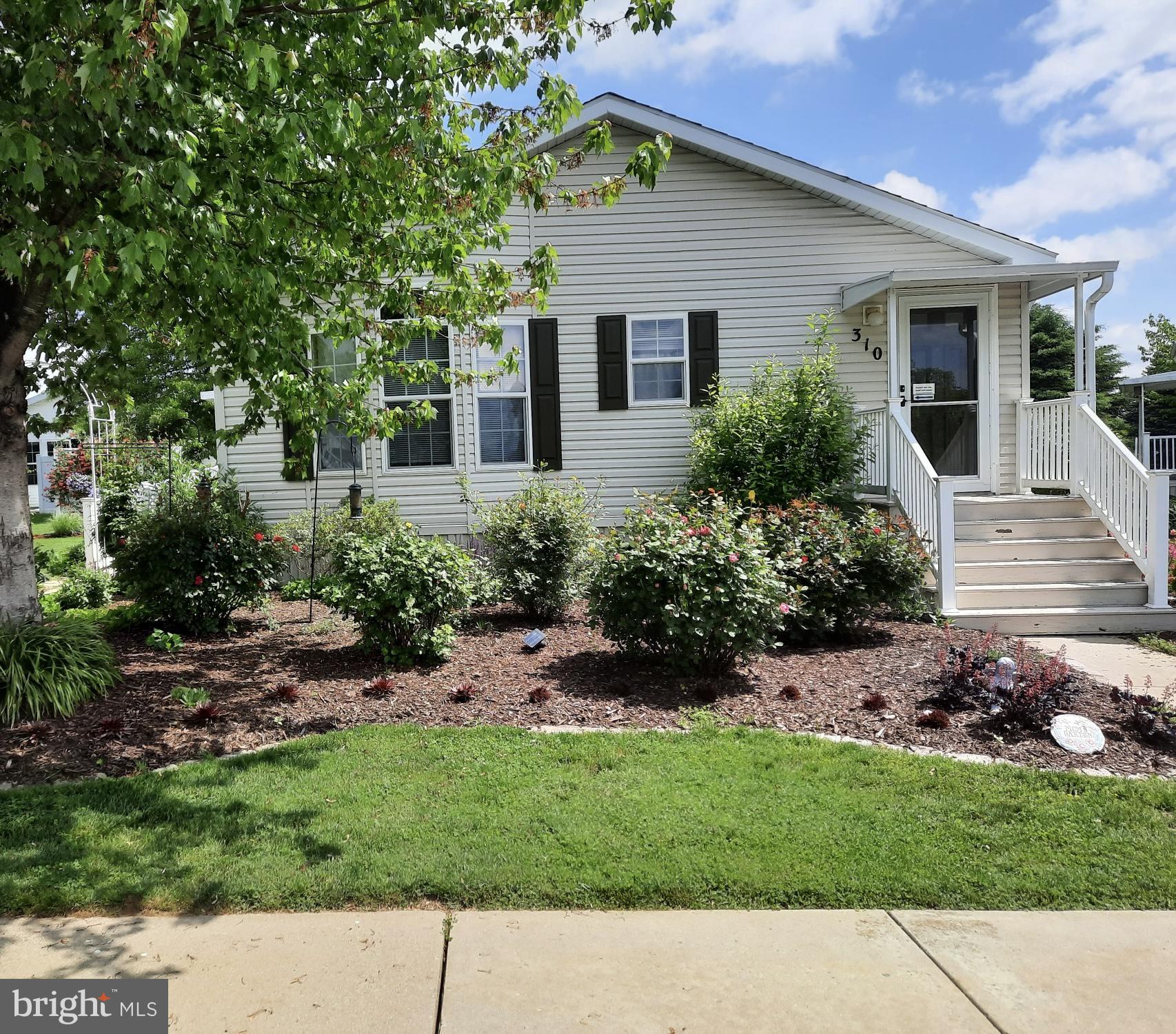 310 Summers Drive Lancaster, PA 17601 - Photo 34 of 44 a front view of a house with a garden