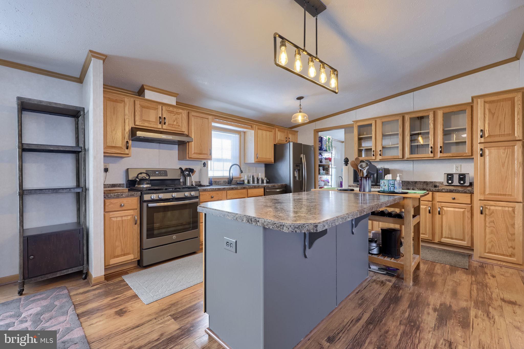 310 Summers Drive Lancaster, PA 17601 - Photo 7 of 44 a kitchen with granite countertop a sink appliances cabinets and counter space