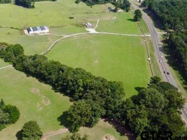 10864 State Highway 64 Overton, TX 75684 - Photo 3 of 5 a view of a green yard