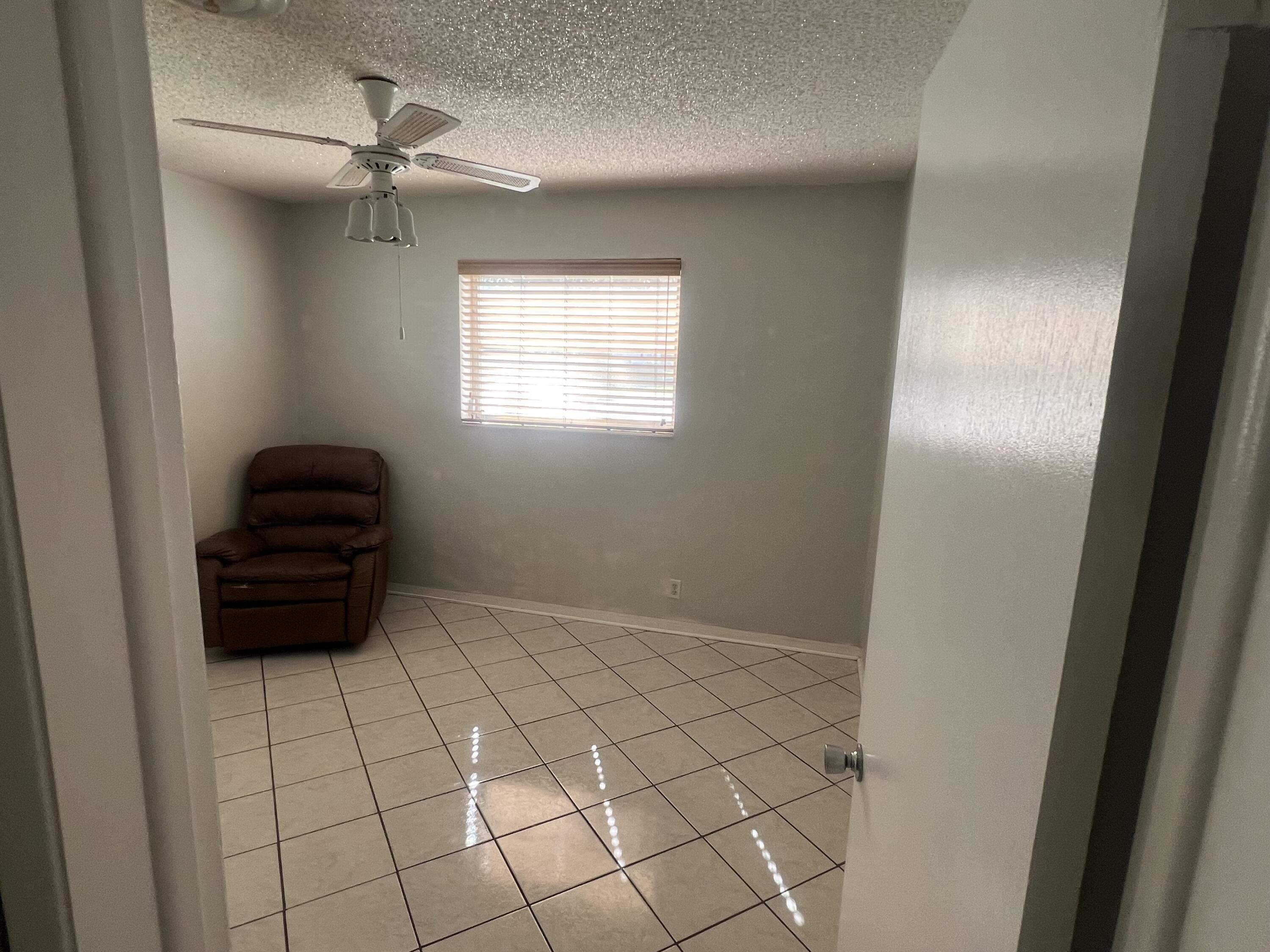4007 Johnson Street Hollywood, FL 33021 - Photo 11 of 14 a room with a lamp and a window