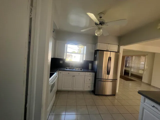 a kitchen with a refrigerator a sink and dishwasher